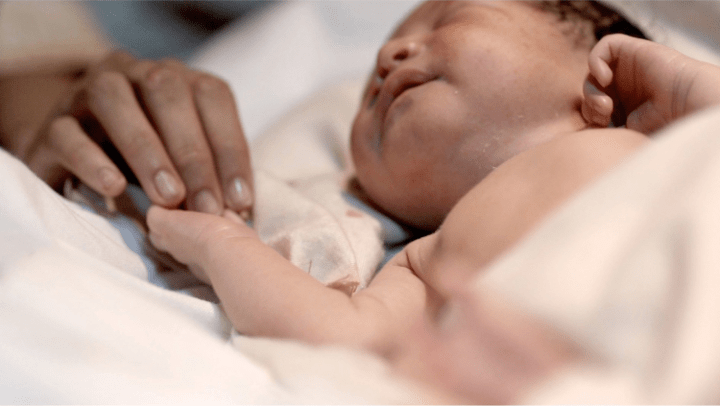 baby with mother's hand